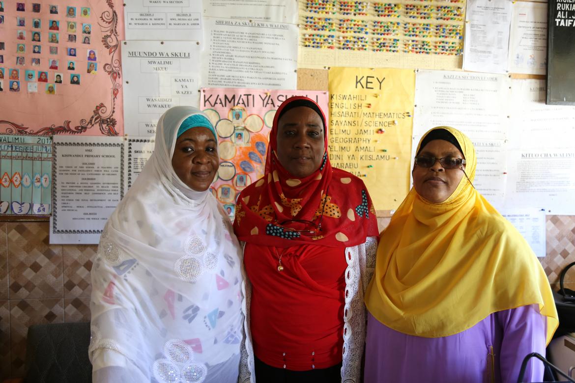 Mrs. Taifa KH Ahmed (in red with her two assistants) has worked a Kisiwandui since 2010. Mrs. Taifa KH Ahmed (in red with her two assistants) has worked a Kisiwandui since 2010.