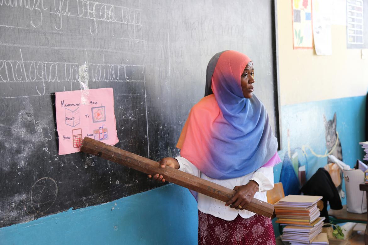 Halima Hmad Juma, their teacher, shows the words as she says them and then the students repeat in unison. Zanzibar is working on training its teachers on inclusion and child friendly classroom practices. Halima Hmad Juma, their teacher, shows the words as she says them and then the students repeat in unison. Zanzibar is working on training its teachers on inclusion and child friendly classroom practices.