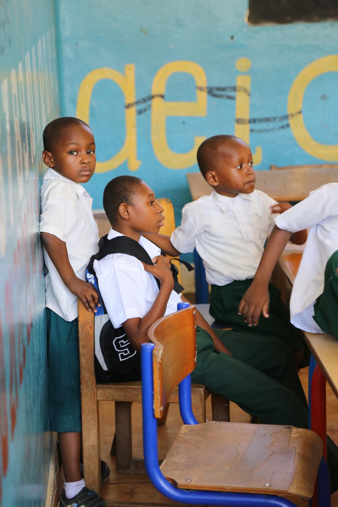 In this pre-primary classroom, learners of all abilities and backgrounds are encouraged to engage together and support each other in the classroom. On the photo are Feisal, Abraham and Hudhaifin.