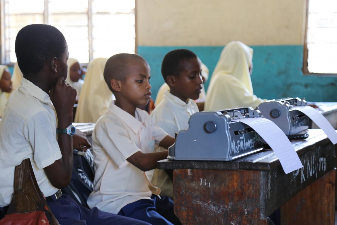 They also have Braille machines to take notes and do exercises. Both learned to use the Braille machine in Grade 3, and before that they were using a slate and stylus to write in Braille.