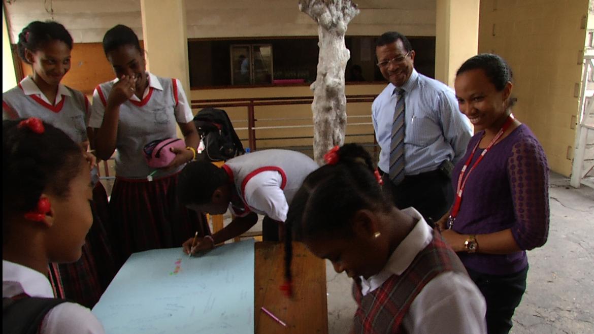 Guy Etienne with students in Haiti 