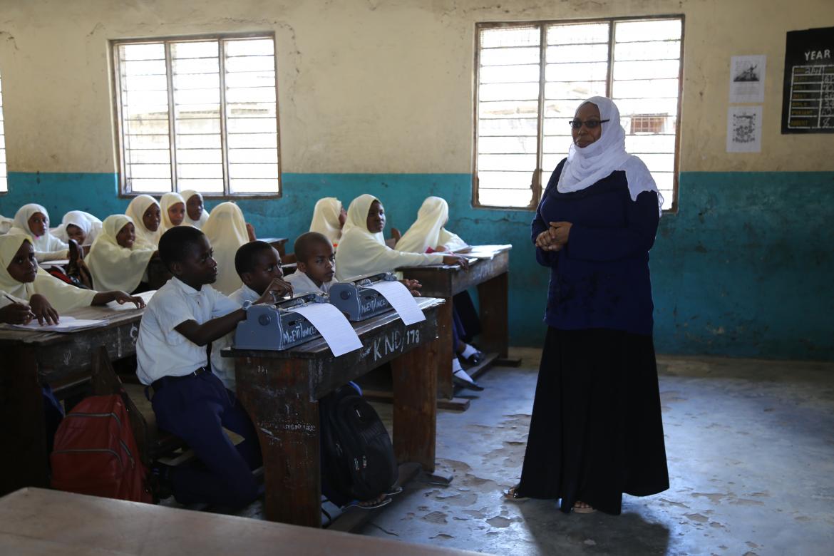 In a grade 6 science class, Ali Moussa and Mahmoud, are committed to learning despite their visual impairment (front row)